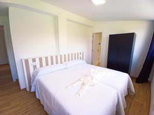 A bed or beds in a room at Casa Carmelo 2