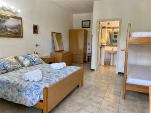 Postel nebo postele na pokoji v ubytování Residenza La Grazia Tropea - Free Parking -