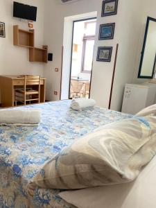 Postel nebo postele na pokoji v ubytování Residenza La Grazia Tropea - Free Parking -