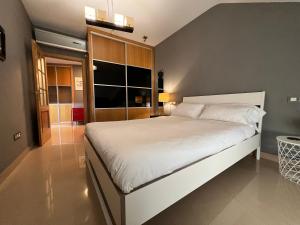 Кровать или кровати в номере AticoAme