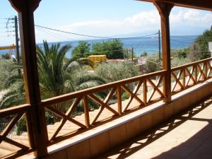 a balcony with a view of the ocean at Villa Anta in Skala Kallirakhis
