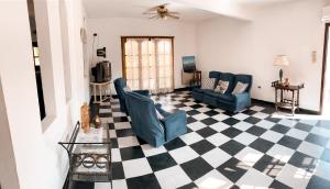 a living room with a black and white checkered floor at Casa Moreno in Belén de Escobar +19 photos