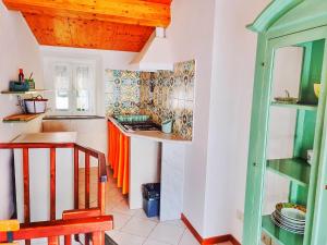 a kitchen with a stove and a counter top at Good vibes penthouse Ca Lidia 5Terreholiday in Riomaggiore