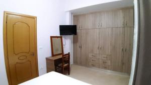 TV a/nebo společenská místnost v ubytování Giorgio Gest House