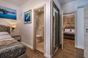 Uma cama ou camas num quarto em Hotel Agava Split