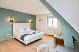 Postel nebo postele na pokoji v ubytování Roscoff Beach House