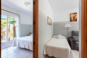 Postel nebo postele na pokoji v ubytování Apartamentos Mundaka Albir