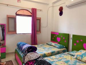 Voodi või voodid majutusasutuse NiLe ViEW RANA NUbian Guest HOUES toas