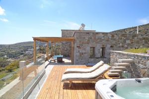 a villa with a swimming pool and a hot tub at Magna Grecia Residence Panoramic View in Episkopíon