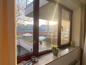 a window with a view of a balcony at t‘Predikheren in Lier