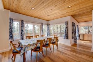 a dining room with a table and chairs at Mountain & Lake-View Delight in Truckee