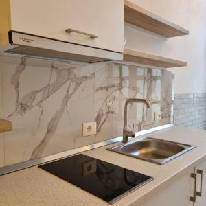 a kitchen with a sink and a counter top at Green Villa in Vlorë