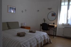 Łóżko lub łóżka w pokoju w obiekcie Villa La Parisienne