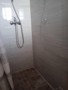 a bathroom with a shower with a glass door at Privatni smještaj Kurtalija in Jajce +45 photos