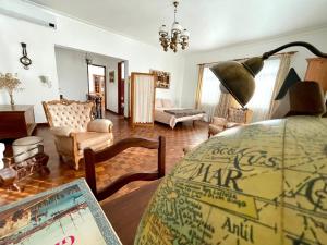 a living room with a couch and a table in a room at Casa Às Oito in Angra do Heroísmo