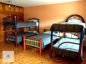 Dviaukštė lova arba lovos apgyvendinimo įstaigoje Hostal Azul Puebla Centro Histórico
