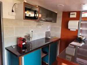 a small kitchen with a counter and a sink at Yangou Appart 2 in Mamoudzou
