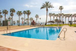 Bazén v ubytovaní Aloha Playa Apartment with panoramic sea view and pools alebo v jeho blízkosti