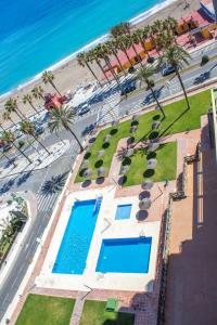 Bazén v ubytovaní Aloha Playa Apartment with panoramic sea view and pools alebo v jeho blízkosti