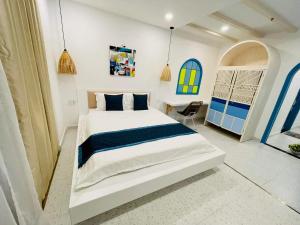 Giường trong phòng chung tại Aria Reasort - BlueShaphire Căn hộ - villa nghỉ dưỡng giáp biển Vũng Tàu
