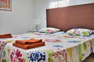 a bedroom with two beds with towels on them at Casa Abeja in Colonia de Sant Pere +21 photos