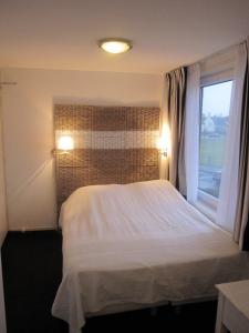 Ein Bett oder Betten in einem Zimmer der Unterkunft Badhotel Zeecroft