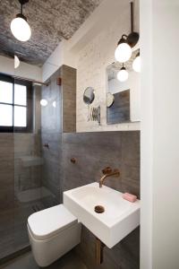 a bathroom with a sink and a toilet and a shower at Square Rooms 8 in Düsseldorf +80 photos