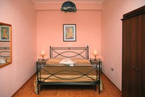 Postel nebo postele na pokoji v ubytování B&B Ulisse