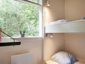 Postel nebo postele na pokoji v ubytování Holiday home Nexø XXXIX