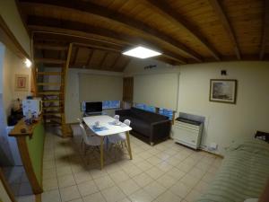 a living room with a table and a couch at La Barranca in Ushuaia