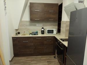 Cucina o angolo cottura di Szellőrózsa Apartman