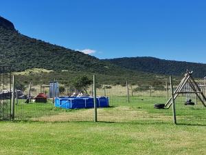 a park with a playground with a play equipment at Village Retreat Ngcamngeni in Debe Nek