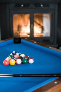 a group of cue balls on a pool table at Casa Rural El Milano in Bullas