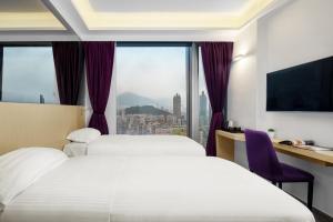 Krevet ili kreveti u jedinici u okviru objekta Starphire Hotel