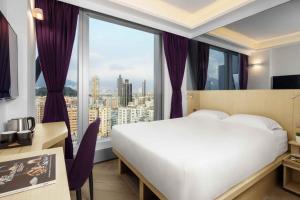 Krevet ili kreveti u jedinici u okviru objekta Starphire Hotel