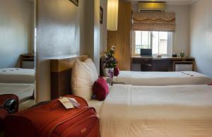 Voodi või voodid majutusasutuse Eliana Ruby Hotel & Travel toas