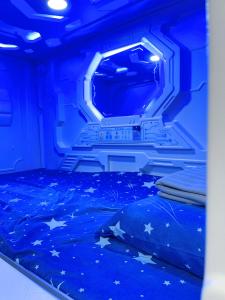 Una cama o camas en una habitación de ZZZ SLEEP MODE CAPSULE