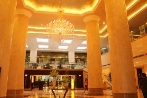 a chandelier in the lobby of a hotel at Beijing Continental Grand Hotel in Beijing