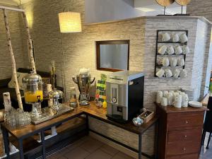 a kitchen with a counter with a coffee maker on it at Hotel garni Zum Rebstock in Naumburg