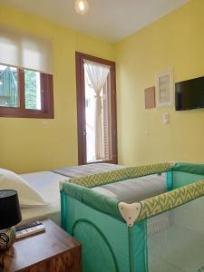 a bedroom with a bunk bed and a window at Marw's home in Nafplio