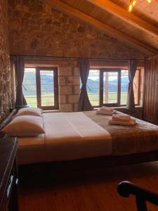 
Ένα ή περισσότερα κρεβάτια σε δωμάτιο στο Αγγελικά στα ορεινά
