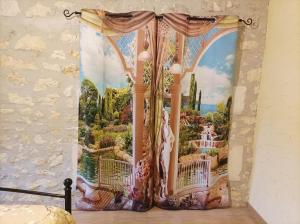 a curtain with a painting of a waterfall at Logis de Chalons à la mer in Le Gua