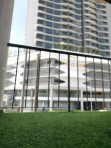 a fence in front of a tall building at HOTEL SENTOSA KOTA BHARU Kelantan in Kota Bharu