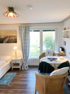a bedroom with a bed and a window at Bungalow "Prinz" in Nebel