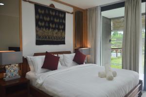 Postel nebo postele na pokoji v ubytování Serenity Private Villa Mas Ubud + 37 fotografií