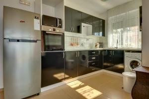 Kuchyň nebo kuchyňský kout v ubytování Montenegro Apartments Utjeha