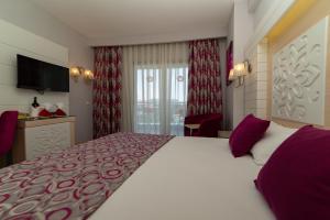 Sunmelia Beach Resort Hotel & Spa-All Inclusiveにあるベッド
