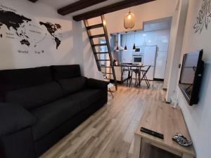 A television and/or entertainment centre at Budha Luxury Apartment Centro Histórico de Málaga