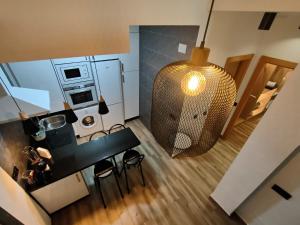 A kitchen or kitchenette at Budha Luxury Apartment Centro Histórico de Málaga