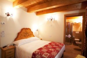 Postel nebo postele na pokoji v ubytování Garnì Astoria Hotel & SPA